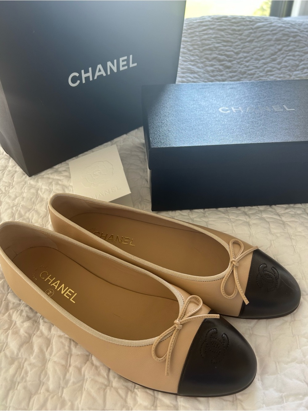 CHANEL Beige Leather Ballet Flats with Black Cap Toe